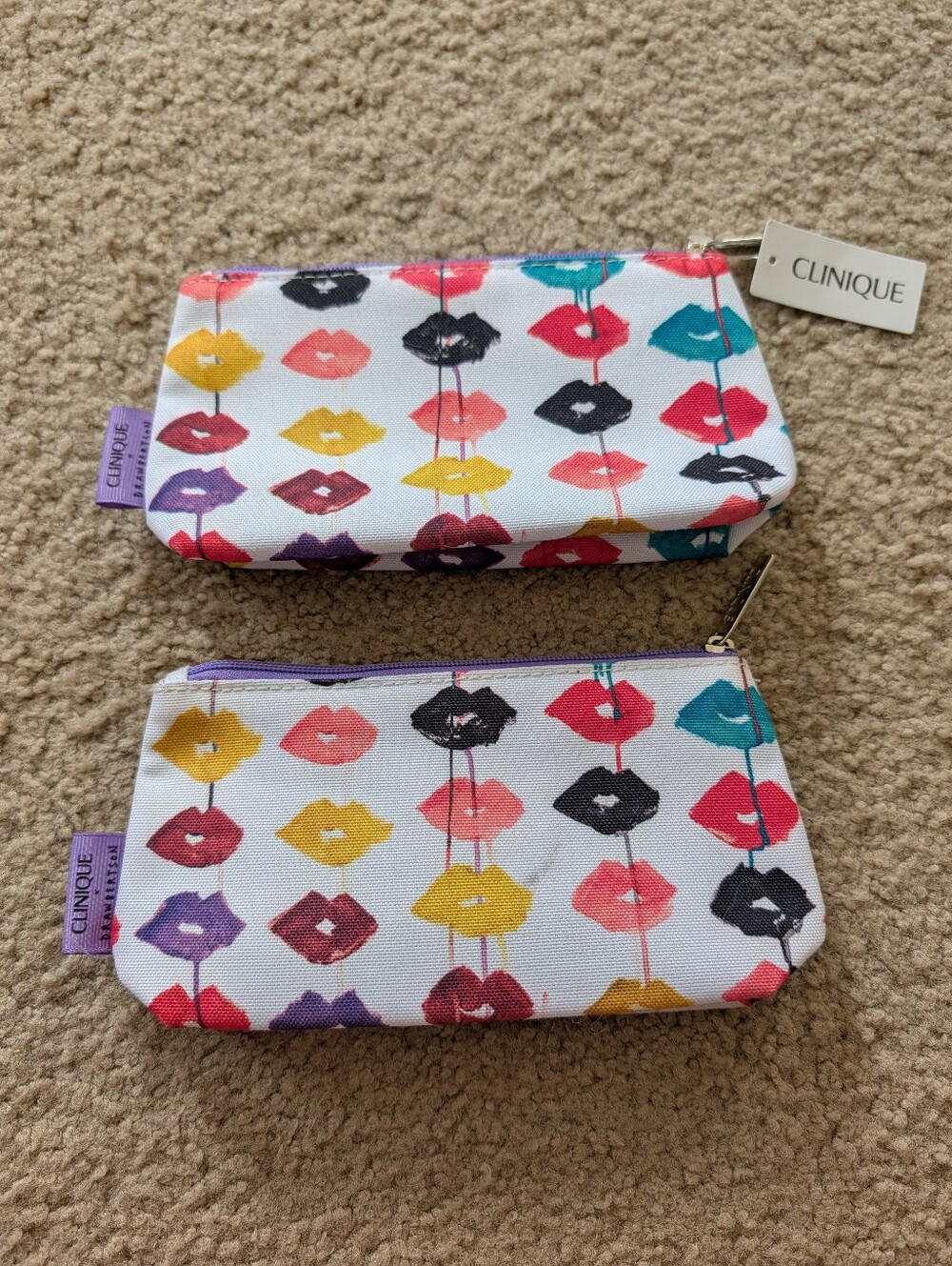 Two Clinique Lip Print Cosmetic Pouches - White with Multicolor Lips